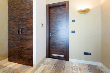 Corridor with closet in hotel room