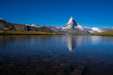 Fototapeta na wymiar Matterhorn peak with reflection at Stellisee lake