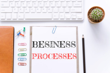 Text Business processes on white paper background / business concept