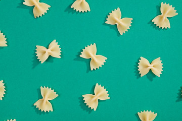 Fototapeta premium Farfalle pasta flat lay pattern