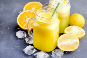 Orange and lemon juice in jars