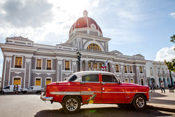 Fototapeta na wymiar City Hall in Jose Marti Park, the UNESCO World Heritage main square of Cienfuegos, Cuba