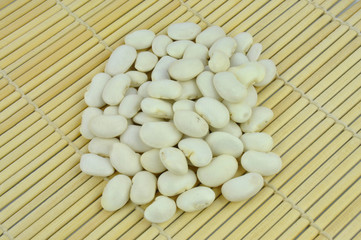White large beans on bamboo mat