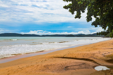 Beach in Thailand with a dark sky in the background