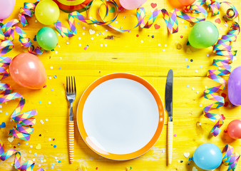 Bright yellow place setting for carnival season