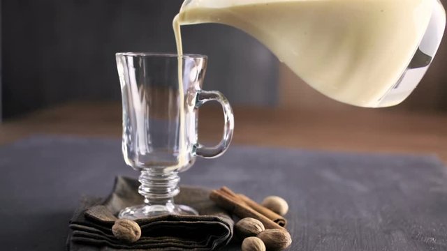 Traditional holiday drink egg nog garnished with nutmeg