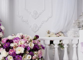 lush bouquet of roses near decorative balcony