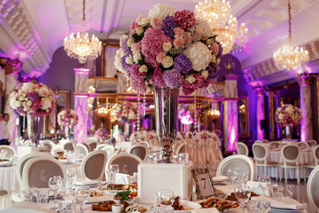 Table number 7 decorated with pink and violet hydrangeas and ser