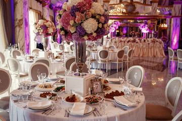 Table number 7 decorated with pink and violet hydrangeas and ser
