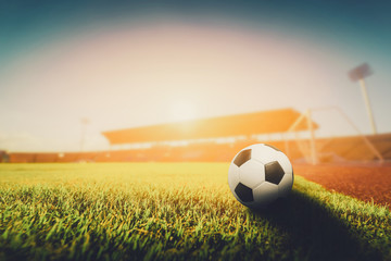 Soccer ball on the  grass in soccer stadium , vintag