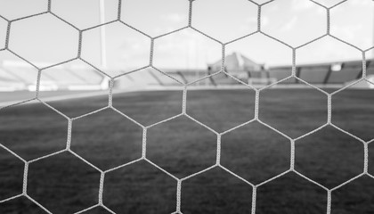 soccer net  at soccer stadium , black and white