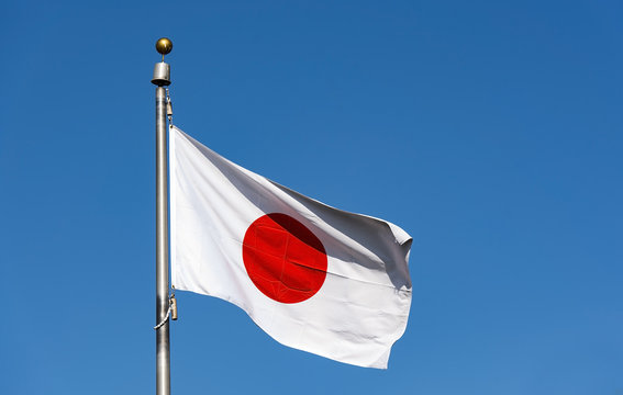 Waved Japan flag. Japanese flag on flagpole. Vector emblem of