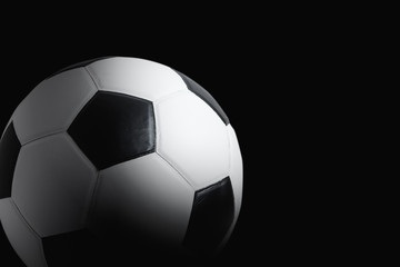 Fototapeta na wymiar soccer ball on black background