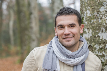 Portrait of beautiful young man in .forest