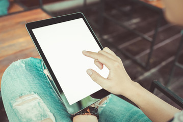 Woman hands holding and pointing on contemporary digital frame w