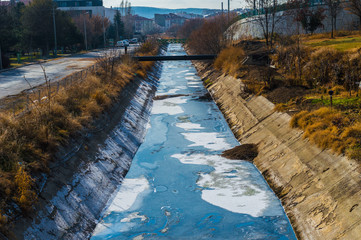 View of waste-water, pollution and garbage in a canal