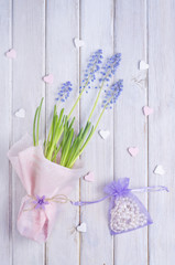 Colorful flowers on the handmade wooden background