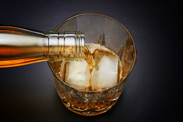 Pouring whiskey in nice glass
