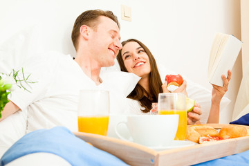 Couple Having Breakfast In Bed