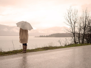 Girl with umbrella in the nature