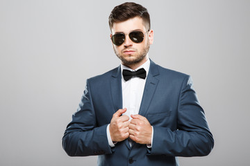 Young man in suit with sunglasses