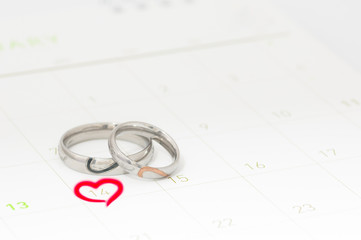 Silver ring in valentine day on the calendar.