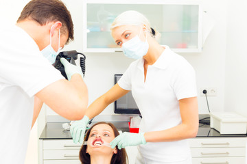 Dentist Taking A Photo Of His Patient's Teeth