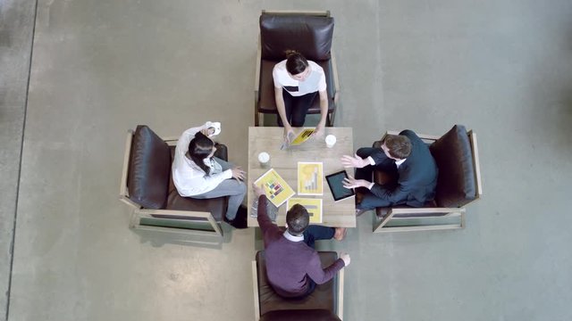 High angle view on business meeting in office lobby