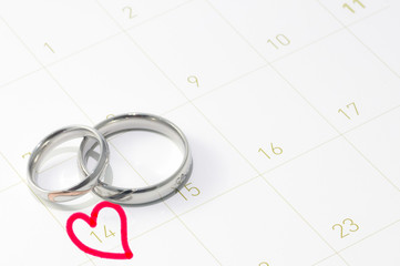 Silver ring in valentine day on the calendar.