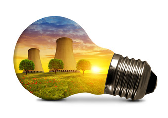 Nuclear power plant in light bulb isolated on white background.