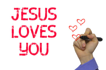 Hand with marker writing word Jesus Loves You