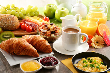 Breakfast served with coffee, juice, egg, and rolls