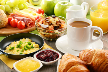 Breakfast served with coffee, juice, egg, and rolls