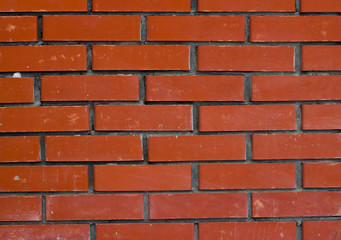 Red brick wall texture background. Tiled.