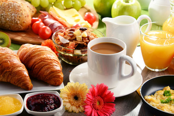 Breakfast served with coffee, juice, egg, and rolls