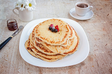Pancakes with berries. Maslenitsa. Selective focus