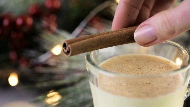 Traditional holiday egg nog garnished with freshly ground nutmeg