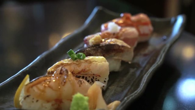 Aburi nigiri set or seared sushi set. Japanese food, raw fish with fast fire burn
