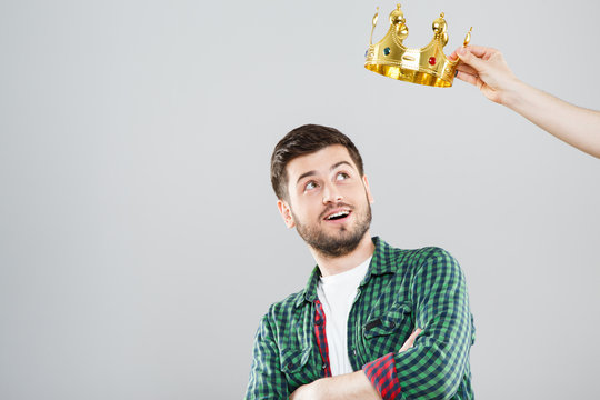 Young man with crown above his head