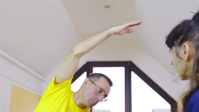 Learner exercise correct shaolin martial arts forms indoors 4K
