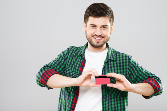 Boy holding red credit card