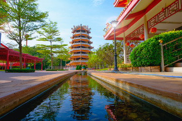 Fototapeta premium Chinese ancient Pagoda and rill under the sky at Dragon descendants Public museum.
