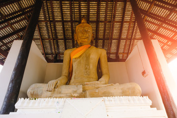 Buddhist statue in old chapel at Wat Sri Rattana Mahathat. this old temple built 600 years ago in Suphanburi, Thailand