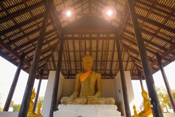 Naklejka premium Buddhist statue in old chapel at Wat Sri Rattana Mahathat. this old temple built 600 years ago in Suphanburi, Thailand
