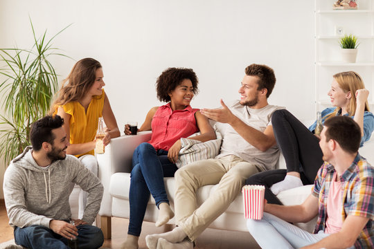 Happy Friends With Popcorn And Beer At Home