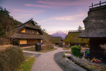 Fototapeta na wymiar Old Japanese style house and Mt. Fuji at sunset