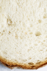 Fresh sliced white bread in close-up shot isolated on white background