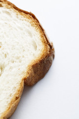 Fresh sliced white bread in close-up shot isolated on white background