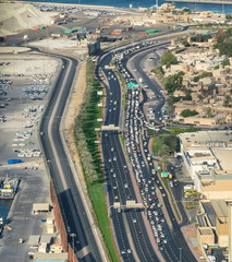 Naklejka na ściany i meble Dubai city traffic, aerial view from helicopter