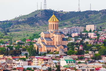 Fototapeta na wymiar Panoramic view of the city with St. Trinity cathedral in Tbilisi, capital of Republic of Georgia